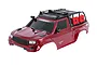 A red Traxxas TRX-4 Sport RC crawler body shell with a black roof rack, snorkel, and red fuel canisters, shown against a white background.