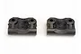 Two black plastic Traxxas rear suspension arm mounts for RC vehicles, shown side-by-side against a white background.