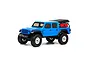 A blue Axial SCX24 Jeep Gladiator RC rock crawler viewed from the side against a white background.