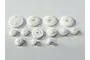 A collection of various white plastic gears for an RC vehicle, arranged on a plain white background.