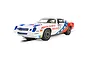 A 1/32 scale Scalextric Chevrolet Camaro Z28 slot car in white, red, and blue livery with American Car Service branding and number 77.