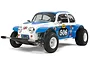A 1/10 scale Tamiya Sand Scorcher RC buggy featuring a white and blue Volkswagen Beetle-style body with racing decals and off-road tires.
