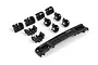 A set of black plastic RC car parts including a front grille with Toyota branding and various light bucket components on a white background.