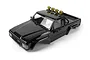 A black HPI Toyota Hilux SR5 RC body shell with a roll bar and four yellow spotlights mounted on the roof, shown from a high-angle perspective.
