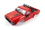 A red HPI Toyota Hilux SR5 RC truck body shell with a roll bar and four roof-mounted spotlights on a white background.