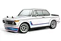 A white HPI Racing BMW 2002 RC car with blue and red racing stripes on a white background.