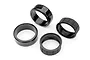 Two smooth black drift tyres and two black rubber tyre inserts arranged on a white background.