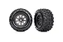 Two Traxxas Sledgehammer RC monster truck tyres mounted on charcoal grey multi-spoke wheels against a white background.