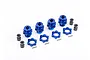 A set of four blue anodized aluminium 17mm wheel hex adapters with matching nuts, pins, and black spacers on a white background.