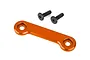 An orange anodized aluminium wing washer plate and two black hex head screws on a white background.
