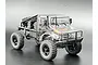 A 1/18 scale Hobby Plus CR-18P T Hunter RC rock crawler with a clear, unpainted polycarbonate truck body, black chassis, and off-road tires.