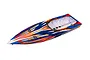 Top-down view of a Traxxas Spartan RC boat hull in orange, blue, and white racing livery against a white background.