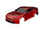 A red Traxxas 1/10 scale Ford Mustang RC car body shell viewed from a high angle against a white background.