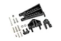 A set of black plastic RC boat parts including a rudder mount, steering arm, and various metal screws and O-rings on a white background.