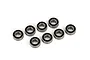Eight metal ball bearings with black rubber seals arranged on a white background.