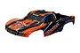 Traxxas Slash 1/10 scale short course truck body shell, pre-painted in orange, black, and blue with Traxxas and BFGoodrich branding.