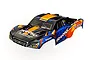 A pre-painted Traxxas Slash short course truck body shell in orange, blue, and black with racing decals on a white background.