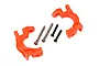 Two bright orange Traxxas heavy duty caster blocks with included metal pins and screws on a white background.