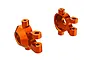 Two orange anodized aluminium steering hubs for Traxxas RC vehicles, shown from an angled perspective against a white background.