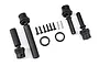 A set of Traxxas centre driveshaft components including four black plastic driveshaft parts, two O-rings, six small screws, and two metal pins.