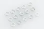 A collection of 15 small silver-coloured split spring washers arranged on a plain white background.