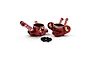 A pair of red anodized aluminium RC steering hubs with brass pivot balls and four small black screws, set against a white background.