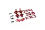 A collection of red anodized aluminium RC car upgrade parts including steering knuckles, suspension arms, and drive shafts on a white background.
