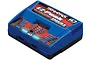 Traxxas EZ-Peak Dual NiMH/LiPo ID charger in blue and black, featuring dual charging ports and LED status indicators on a white background.