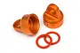 Two orange anodized aluminium shock caps and two orange rubber O-rings on a white background.