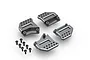 A set of four gunmetal grey aluminium shock towers for an RC car, arranged with eight matching black screws on a white background.