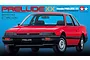 Box art for Tamiya 1/24 scale Honda Prelude XX model kit featuring a red car on a blue background.