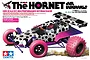 Tamiya The Hornet Jun Watanabe Edition 1/10 scale RC buggy kit box art featuring a white car with black polka dots, pink wheels, and purple accents.