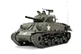 A 1/16 scale Tamiya M4 Sherman 105mm Howitzer RC tank model painted in olive drab with white star markings and a tank commander figure.