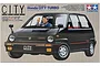 Tamiya 1/24 scale Honda City Turbo model kit box art featuring a black hatchback car with a driver figure.