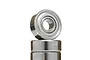 A close-up studio shot of two stacked metal shielded ball bearings against a white background.