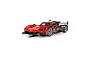 A 1/32 scale Scalextric Cadillac V-Series R slot car in red and black Whelen Engineering livery, viewed from a front three-quarter angle.