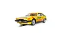 A 1/32 scale Scalextric slot car model of the 1983 Rover SD1 BTCC race car, featuring a yellow livery with Hepolite and Esso branding on a white background.