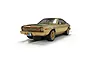 A gold-colored Scalextric 1/32 scale AMC Hornet slot car from The Man With The Golden Gun, shown on a white background.