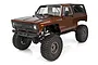 Element RC Enduro Trailwalker brown 1/10 scale RC rock crawler truck on a white background.