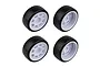 Four Team Associated 1/10 scale drift wheels with smooth black tyres and white multi-spoke rims, arranged in a grid on a white background.
