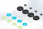 A digital render of MIP 16mm 8-hole bypass pistons, including black piston discs, small metal spacers, and various coloured thin washers.