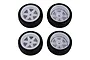 Four Team Associated 1.9 inch RC car wheels with black rubber tires and white six-spoke rims arranged in a square pattern against a white background.