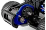 Close-up of a Traxxas Magnum 272R transmission installed on an RC vehicle chassis, featuring a blue anodized motor plate and exposed spur gear.