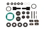 Team Associated differential rebuild kit containing various metal gears, outdrives, washers, pins, and a green gasket on a white background.