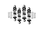 A set of four GPM Racing adjustable RC shock absorbers in silver and black, with four additional loose coil springs on a white background.