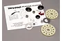Traxxas slipper clutch set components including two spur gears, metal washers, nuts, and small red friction pads arranged on an instruction sheet.