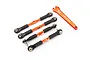 Four orange aluminium camber links with black plastic rod ends and a matching orange Traxxas turnbuckle wrench on a white background.