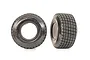 Two Traxxas Hoosier dirt oval RC tyres with foam inserts, showing side profile and tread pattern.