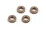 Four small bronze-coloured metal bushings arranged on a plain white background.