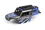 A blue and grey pre-painted Maverick Doha RC truck body shell with black roof accessories and spare tire mount.